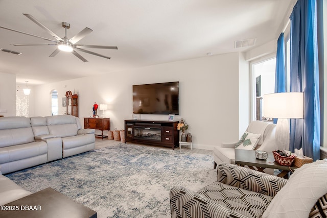 living room with ceiling fan and wood-type flooring