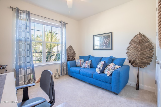 carpeted home office featuring ceiling fan and plenty of natural light