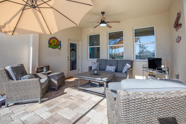 view of patio featuring outdoor lounge area and ceiling fan