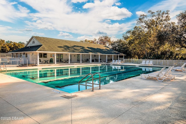 view of swimming pool with a patio area