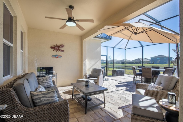 view of patio with an outdoor hangout area, ceiling fan, and a lanai