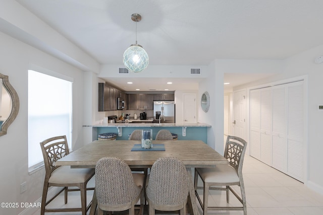 3721 S Atlantic Ave Unit 1101, Daytona Beach Shores, FL 32118 - dining space featuring baseboards and light tile patterned floors