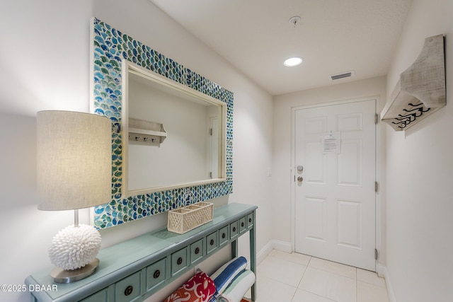 3721 S Atlantic Ave Unit 1101, Daytona Beach Shores, FL 32118 - entrance foyer with light tile patterned flooring and recessed lighting