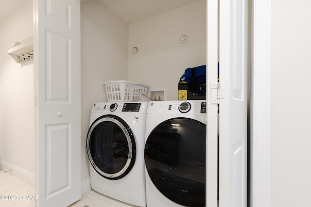 3721 S Atlantic Ave Unit 1101, Daytona Beach Shores, FL 32118 - laundry room featuring separate washer and dryer and light tile patterned flooring