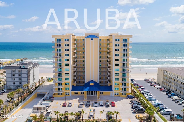 3721 S Atlantic Ave Unit 1101, Daytona Beach Shores, FL 32118 - view of apartment building / complex featuring uncovered parking and view of water and beach