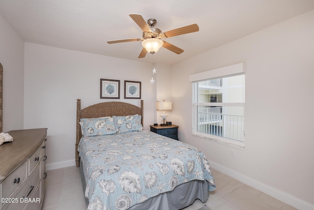 3721 S Atlantic Ave Unit 1101, Daytona Beach Shores, FL 32118 - bedroom featuring a ceiling fan and light tile patterned flooring