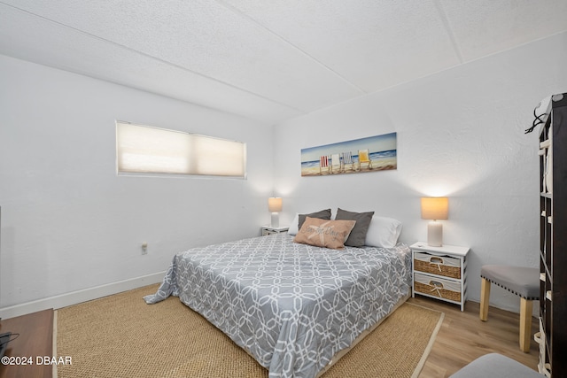 bedroom featuring hardwood / wood-style floors