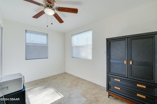 spare room featuring ceiling fan