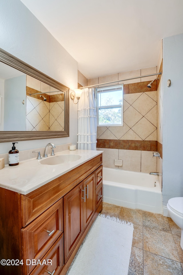 full bathroom featuring vanity, shower / bath combination with curtain, and toilet