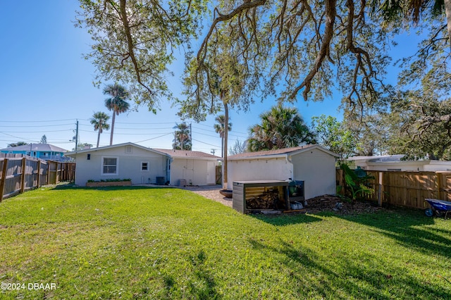 back of house with a yard