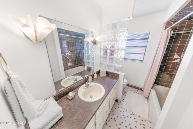 full bathroom featuring tile patterned floors, vanity, shower / bath combination with curtain, and toilet