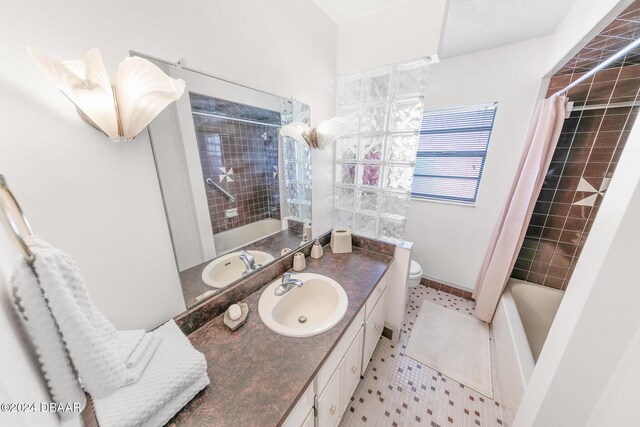 110 Ponce Terrace Cir, Ponce Inlet, FL 32127 - full bathroom with vanity, toilet, shower / bath combo with shower curtain, and tile patterned floors