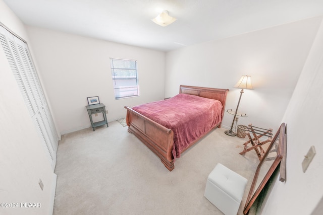 carpeted bedroom with a closet