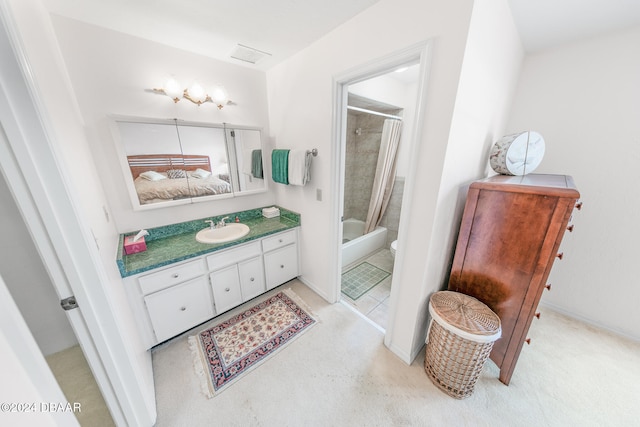 bathroom featuring vanity and tiled shower / bath combo