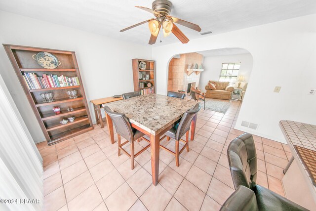 110 Ponce Terrace Cir, Ponce Inlet, FL 32127 - dining area featuring arched walkways, ceiling fan, and light tile patterned floors
