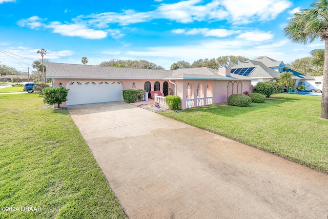 single story home with a front yard and a garage