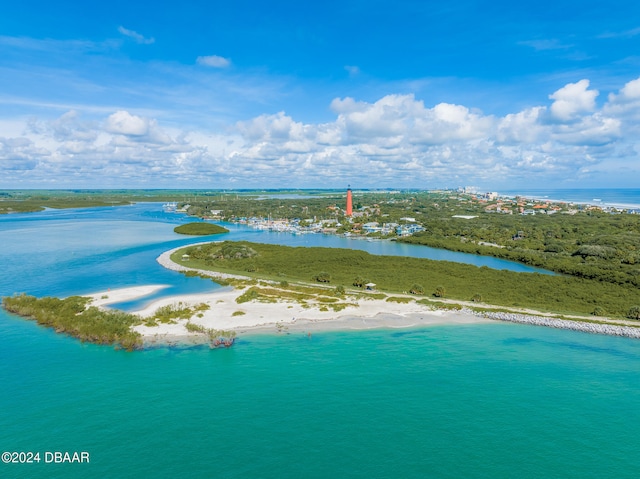 aerial view featuring a water view and a view of the beach