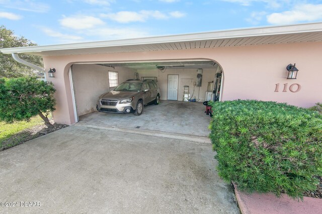 110 Ponce Terrace Cir, Ponce Inlet, FL 32127 - garage featuring concrete driveway