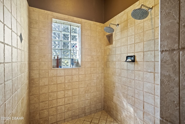 bathroom with a tile shower