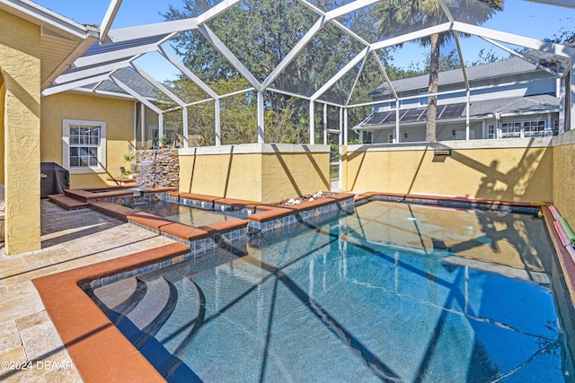 view of pool featuring a patio area and a lanai