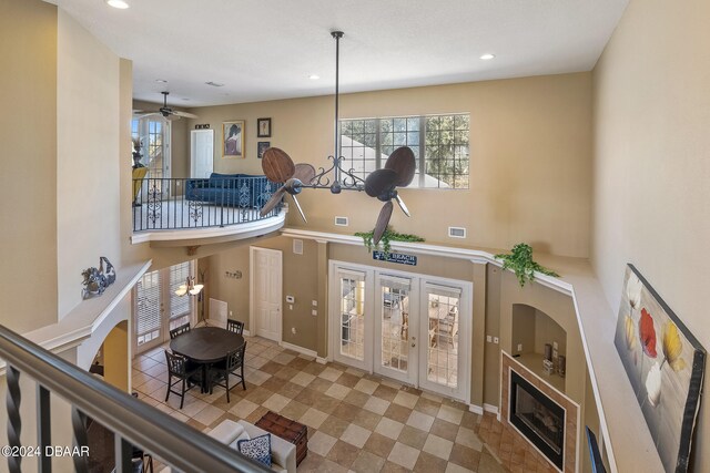 interior space with french doors and ceiling fan