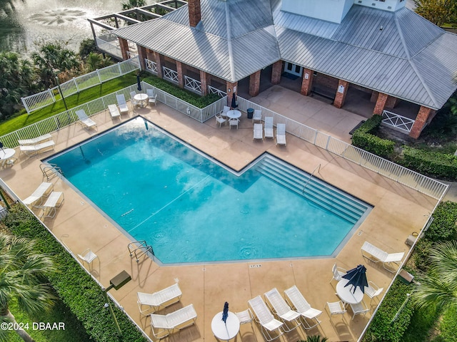 view of swimming pool with a patio