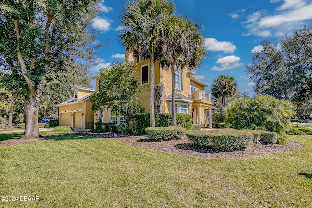 view of front of home featuring a garage and a front lawn