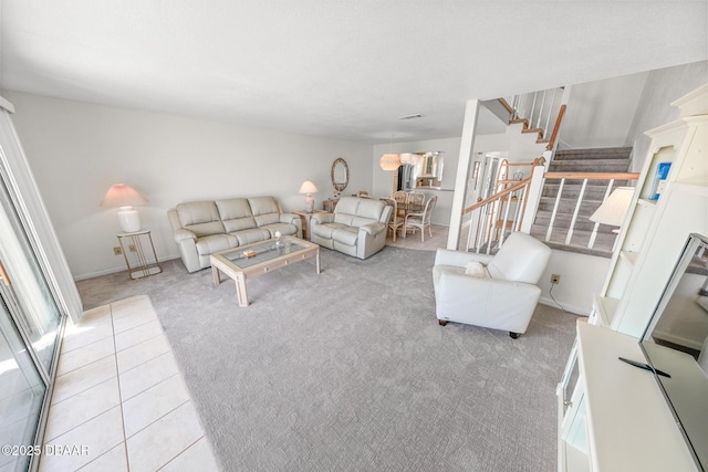 4777 S Atlantic Ave Unit B2, Ponce Inlet, FL 32127 - living area with stairs, light colored carpet, and light tile patterned flooring