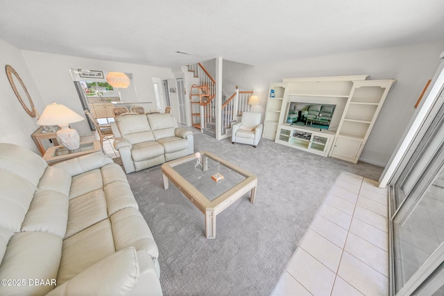 4777 S Atlantic Ave Unit B2, Ponce Inlet, FL 32127 - living room with stairs and light colored carpet