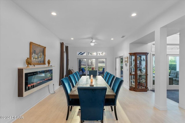 dining space featuring light hardwood / wood-style floors, a wealth of natural light, and ceiling fan