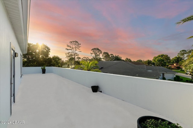 patio terrace at dusk with a balcony