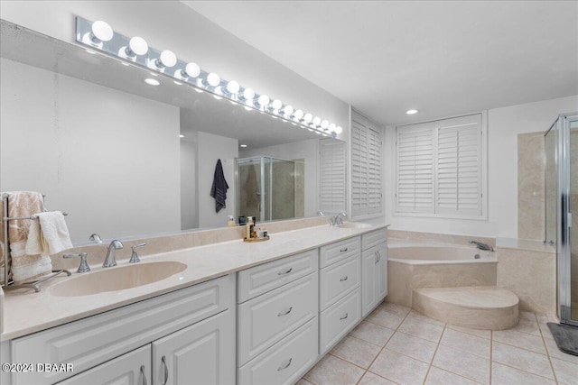 bathroom featuring vanity, separate shower and tub, and tile patterned floors