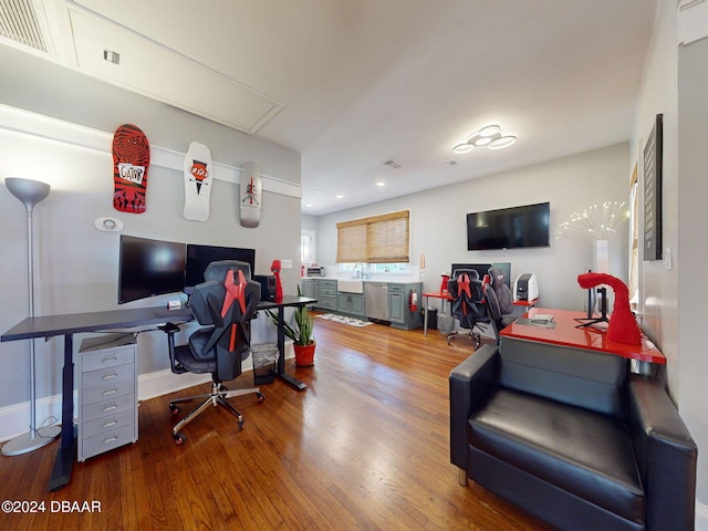 home office with hardwood / wood-style floors