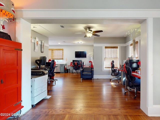 home office with ceiling fan and dark hardwood / wood-style flooring