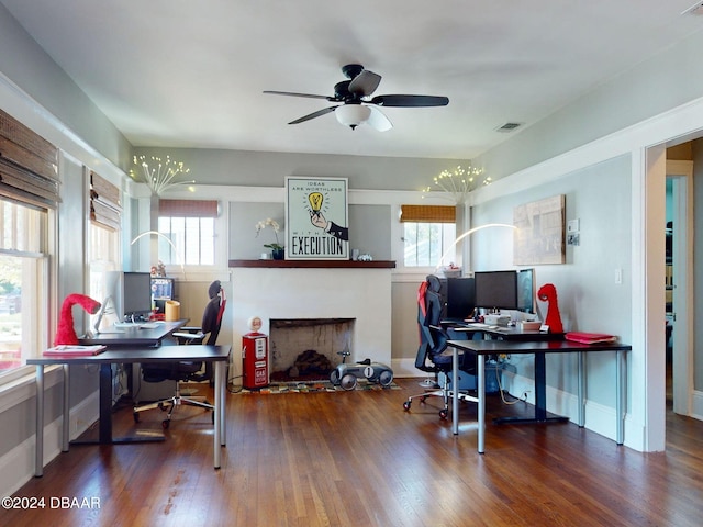 home office featuring hardwood / wood-style flooring and ceiling fan