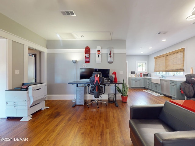 office featuring dark hardwood / wood-style flooring and sink