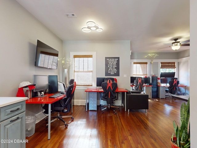 home office featuring dark hardwood / wood-style floors and ceiling fan