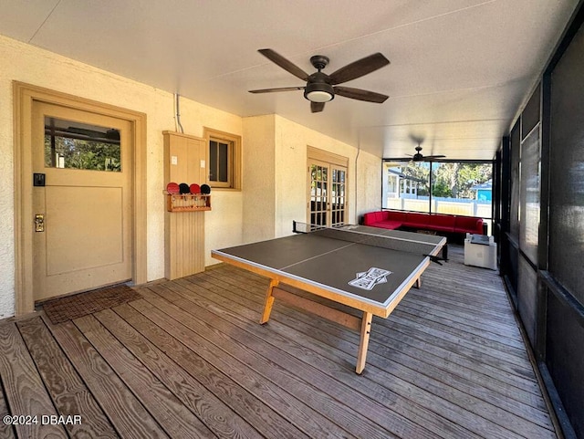 playroom with wood-type flooring and ceiling fan