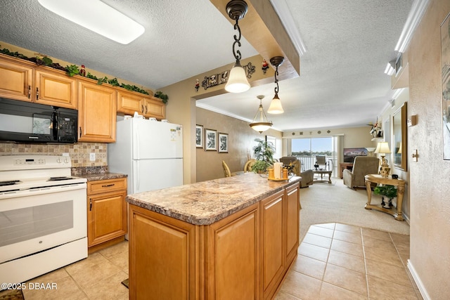 kitchen with white appliances, a kitchen island, hanging light fixtures, and a textured ceiling