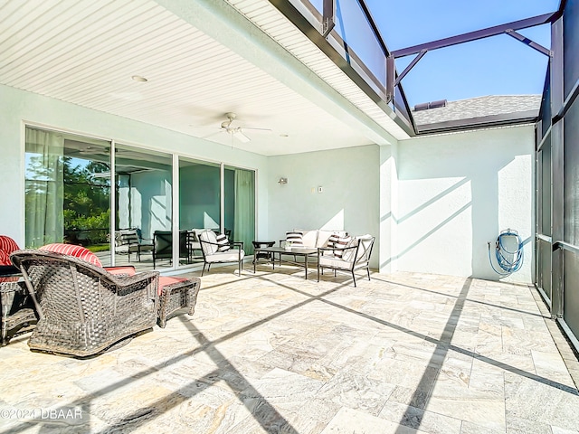 view of patio / terrace featuring ceiling fan, outdoor lounge area, and glass enclosure