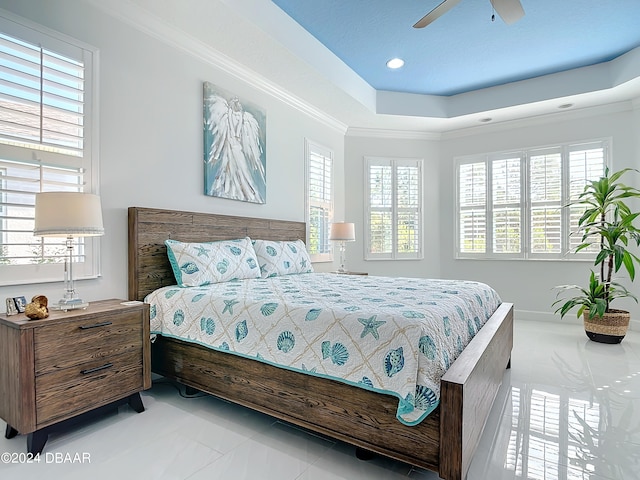 bedroom with ceiling fan, multiple windows, and crown molding