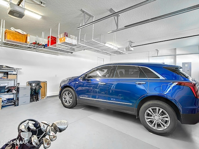 126 Island Breeze Ave, Daytona Beach, FL 32124 - garage featuring a garage door opener and electric panel