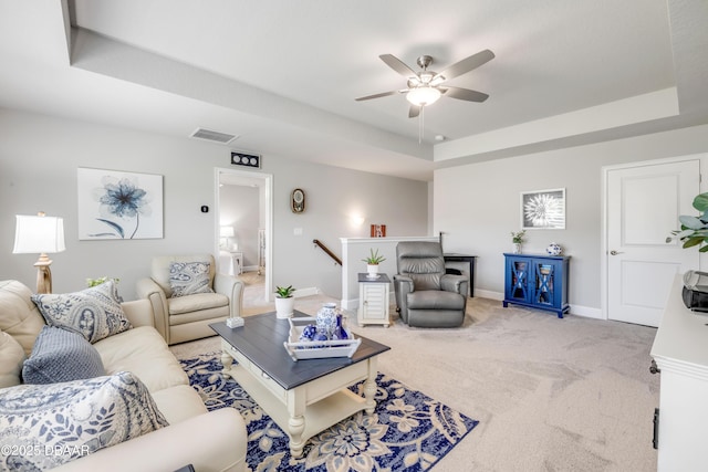 110 Longridge Ln, Ormond Beach, FL 32174 - living area featuring a raised ceiling, ceiling fan, carpet flooring, and baseboards