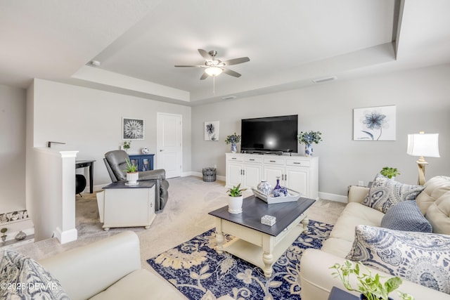 110 Longridge Ln, Ormond Beach, FL 32174 - living area with a tray ceiling, a ceiling fan, light colored carpet, and baseboards