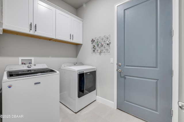 110 Longridge Ln, Ormond Beach, FL 32174 - laundry area with washing machine and dryer, cabinet space, and baseboards