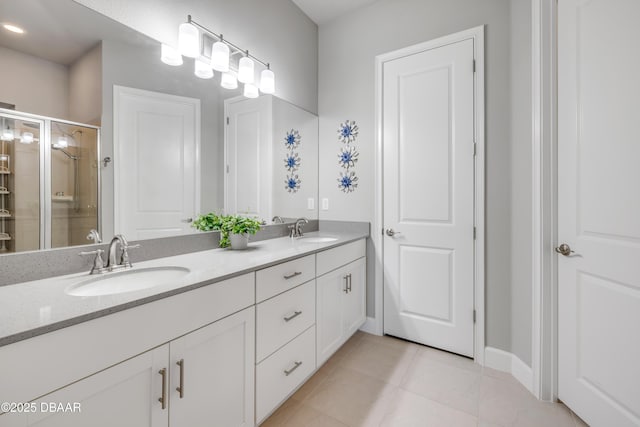 110 Longridge Ln, Ormond Beach, FL 32174 - full bathroom with double vanity, a stall shower, tile patterned flooring, and baseboards