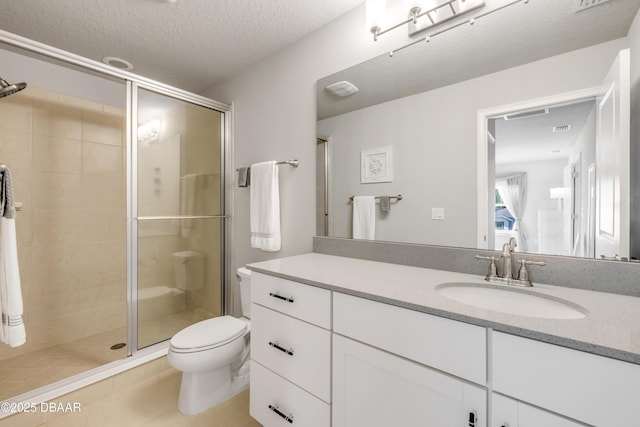 110 Longridge Ln, Ormond Beach, FL 32174 - bathroom featuring toilet, a shower stall, vanity, tile patterned floors, and a textured ceiling