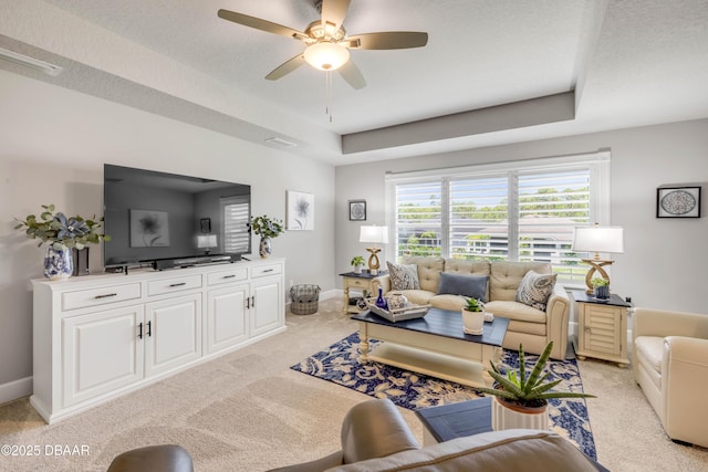 110 Longridge Ln, Ormond Beach, FL 32174 - living room with light carpet, a tray ceiling, ceiling fan, and baseboards