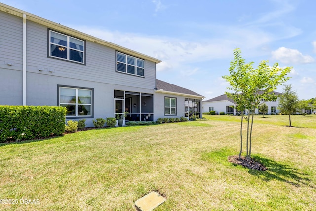 110 Longridge Ln, Ormond Beach, FL 32174 - rear view of property with a sunroom, a lawn, and stucco siding