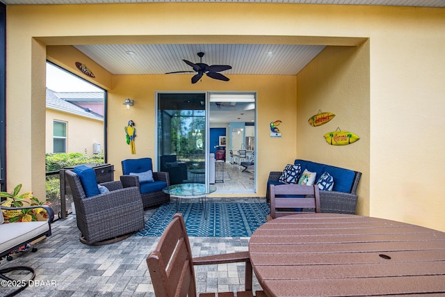 view of patio with ceiling fan and outdoor lounge area